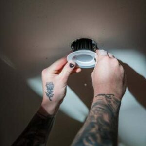 Hamilton Electrician installing LED downlight in residential ceiling